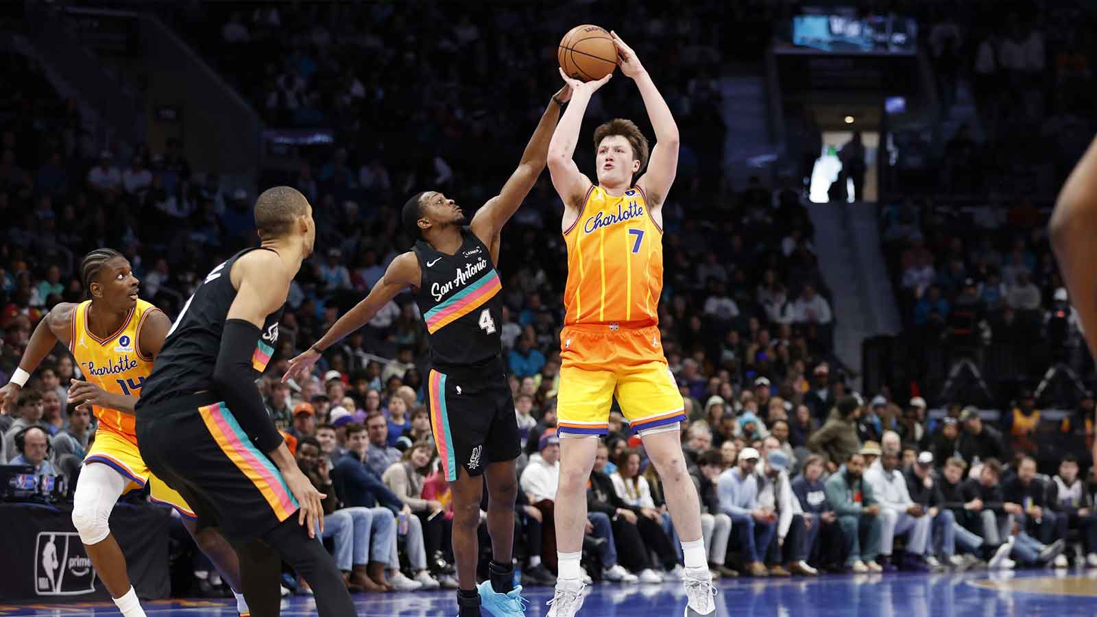 Charlotte Hornets guard Kon Knueppel (7) shoots over San Antonio Spurs guard De'aaron Fox (4)