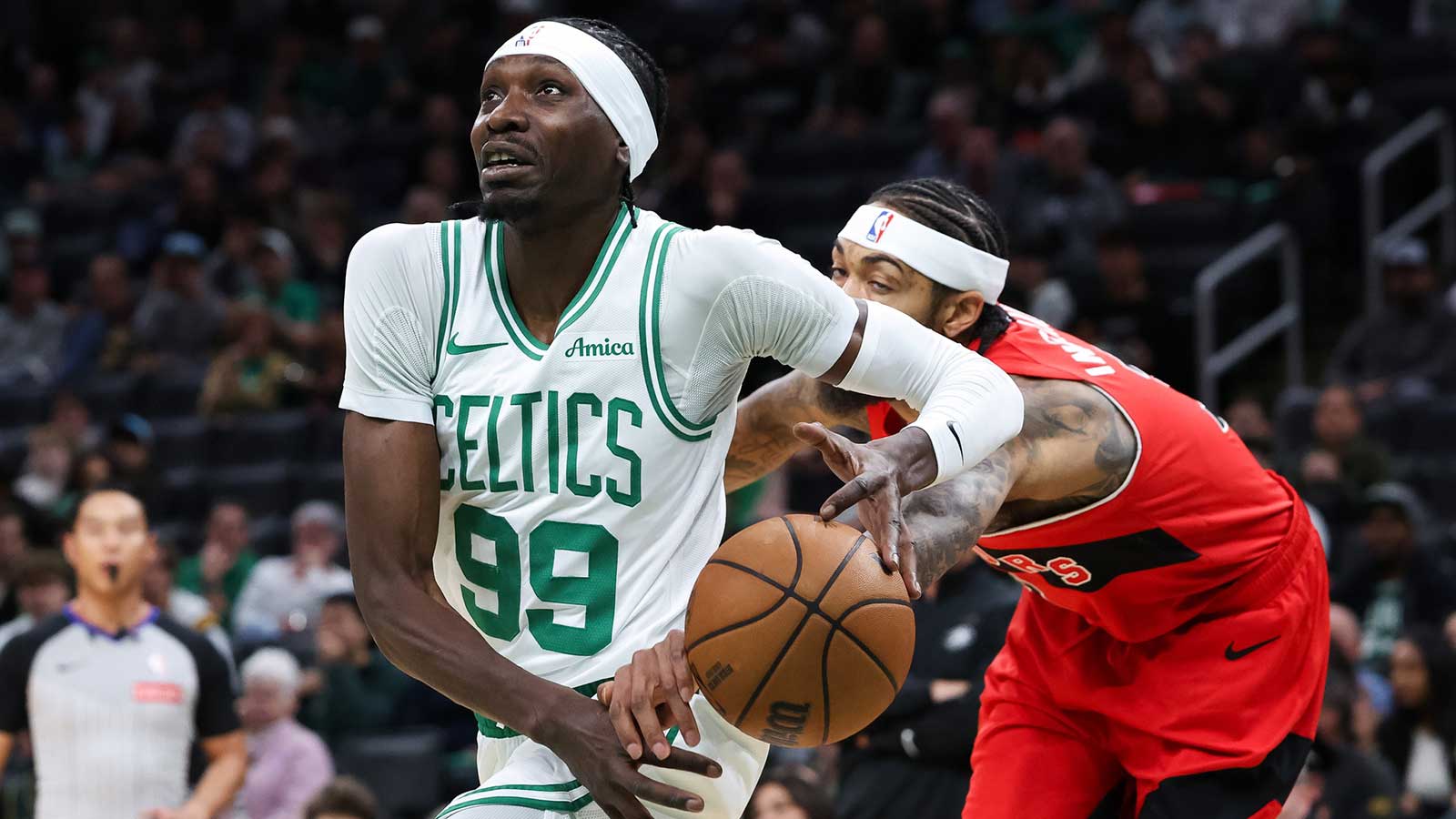 Toronto Raptors forward Brandon Ingram (3) knocks the ball away from Boston Celtics center Chris Boucher (99) during the first half at TD Garden.
