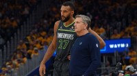 Minnesota Timberwolves center Rudy Gobert (27) talks with Minnesota Timberwolves head coach Chris Finch in the second quarter against the Golden State Warriors during game three in the second round of the 2025 NBA Playoffs at Chase Center.