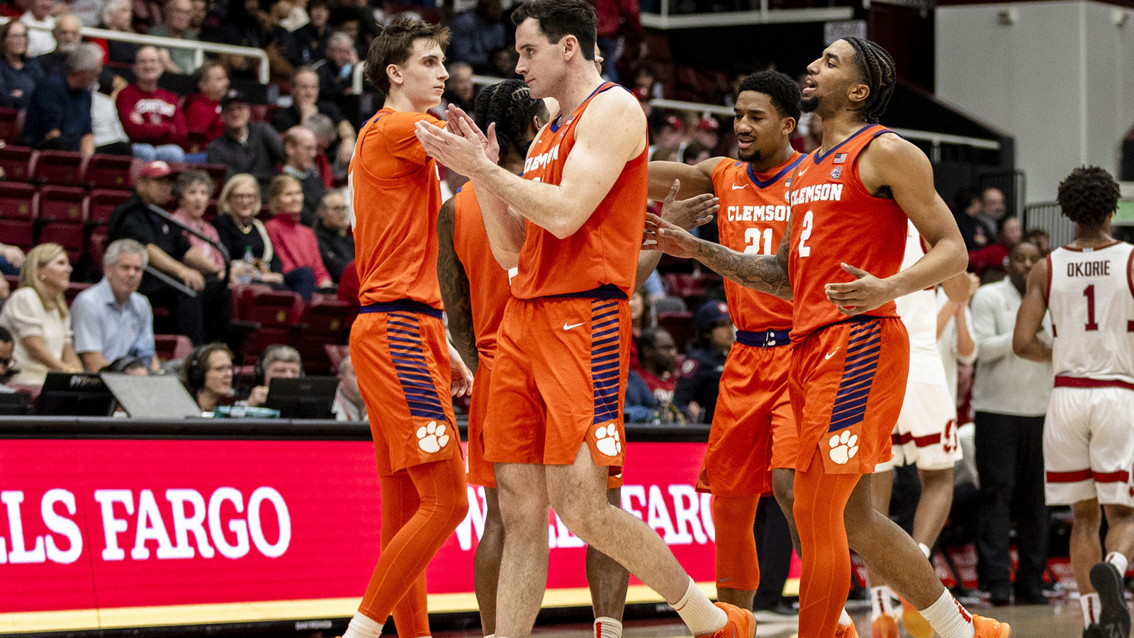 Clemson Tigers forward Nick Davidson (11), guard Dillon Hunter (2) and other players celebrate after defeating Stanford Cardinal at Maples Pavilion. 