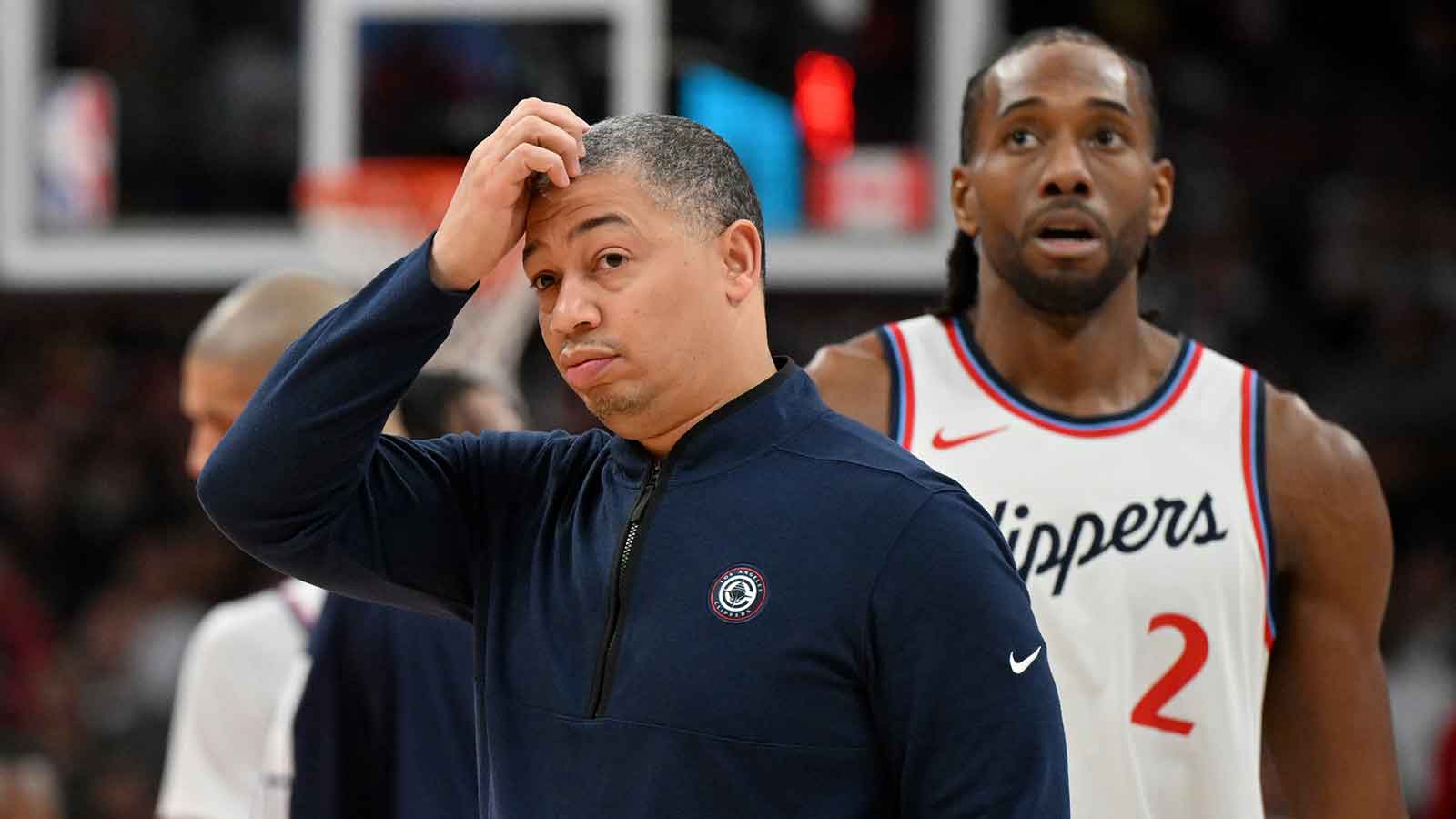 Clippers head coach Tyronn Lue scratches his head after calling a time out as forward Kawhi Leonard (2) walks past in the first half against the Toronto Raptors at Scotiabank Arena