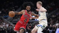 Chicago Bulls guard Coby White (0) drives to the basket against Milwaukee Bucks guard AJ Green (20) in the first half at Fiserv Forum.