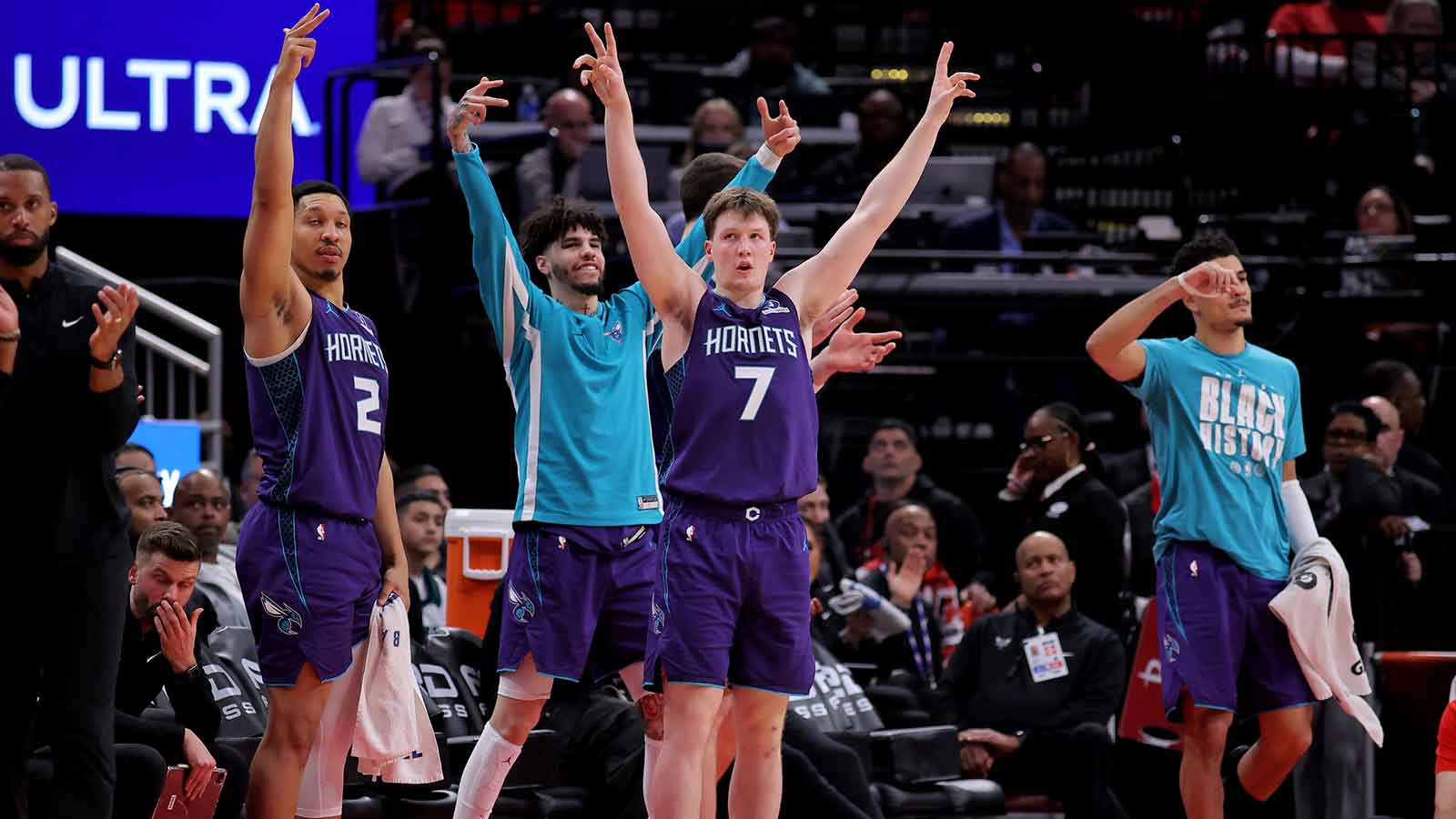 Charlotte Hornets players react after a basket against the Houston Rockets during the fourth quarter at Toyota Center.