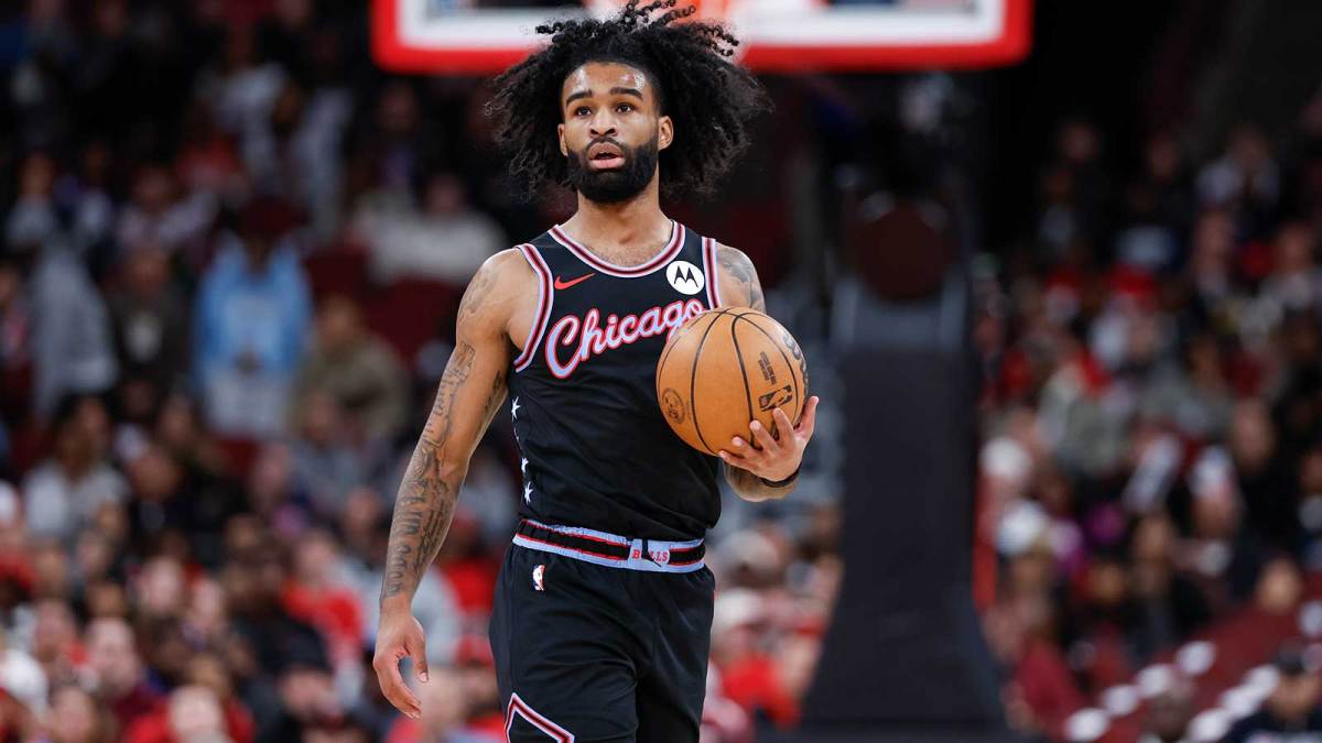 Chicago Bulls guard Coby White (0) brings the ball up court against the Miami Heat during the first half at United Center.