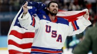 Connor Hellebuyck (37) of the United States celebrates after defeating Canada in the men's ice hockey gold medal game during the Milano Cortina 2026 Olympic Winter Games at Milano Santagiulia Ice Hockey Arena.