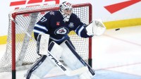 Winnipeg Jets goaltender Connor Hellebuyck (37) warms up before a game against the Montreal Canadiens at Canada Life Centre.