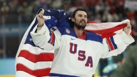 Connor Hellebuyck #37 of Team United States celebrates after winning the goal medal game against Team Canada during the Milano Cortina 2026 Olympic Winter Games at Milano Santagiulia Ice Hockey Arena.
