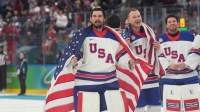Connor Hellebuyck (37) of the United States celebrates after defeating Canada in the men's ice hockey gold medal game during the Milano Cortina 2026 Olympic Winter Games at Milano Santagiulia Ice Hockey Arena.
