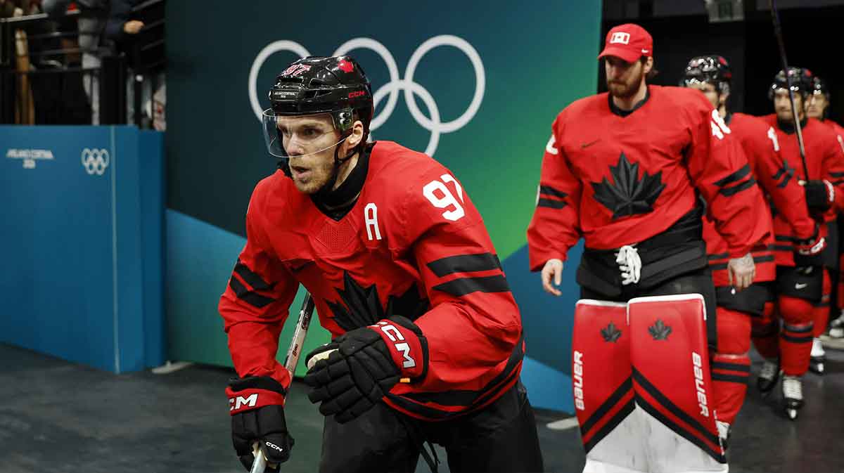 Connor McDavid of Canada walks out to the ice before a men's ice hockey quarterfinal during the Milano Cortina 2026 Olympic Winter Games at Milano Santagiulia Ice Hockey Arena.