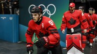 Connor McDavid of Canada walks out to the ice before a men's ice hockey quarterfinal during the Milano Cortina 2026 Olympic Winter Games at Milano Santagiulia Ice Hockey Arena.