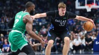 Dallas Mavericks forward Cooper Flagg (32) controls the ball as Boston Celtics guard Jaylen Brown (7) defends during the first quarter at American Airlines Center. Mandatory Credit: Kevin Jairaj-Imagn Images