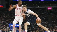 Dallas Mavericks forward Cooper Flagg (32) drives with the ball as Houston Rockets forward Kevin Durant (7) defends during the third quarter at Toyota Center.