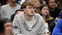 Dallas Mavericks forward Cooper Flagg looks on from the team bench during the second half against the Memphis Grizzlies at the American Airlines Center.
