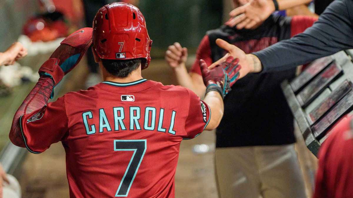 Arizona Diamondbacks outfielder Corbin Carroll (7) celebreats with his team after scoring in the eighth inning against the Philadelphia Phillies at Chase Field.