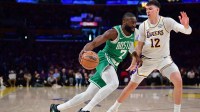 Boston Celtics guard Jaylen Brown (7) moves to the basket against Los Angeles Lakers forward Jake LaRavia (12) during the first half at Crypto.com Arena.