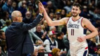 Connecticut Huskies head coach Dan Hurley congratulates forward Alex Karaban (11) coming off the court as they take on the DePaul Blue Demons at Harry A. Gampel Pavilion.