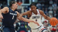 UConn Huskies guard Silas Demary Jr. (2) drives the ball against Xavier Musketeers guard Malik Messina-Moore (1) in the second half at PeoplesBank Arena.