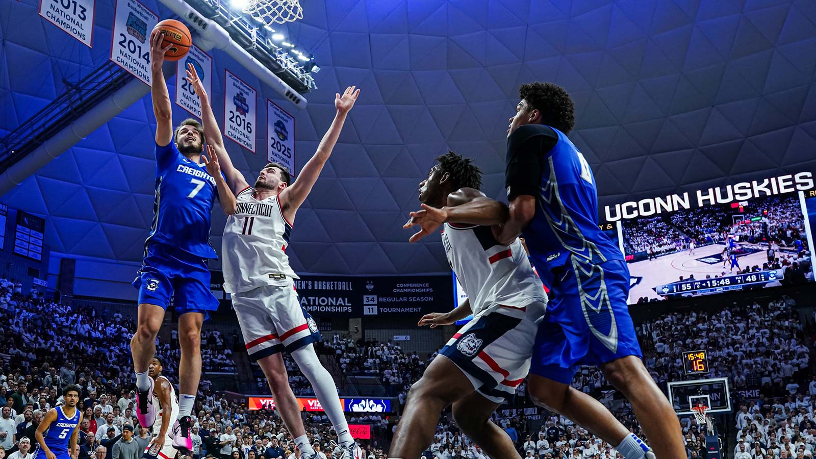 Creighton Bluejays guard Fedor Žugić (7) shoots the ball against UConn Huskies forward Alex Karaban (11) in the second half at Harry A. Gampel Pavilion.