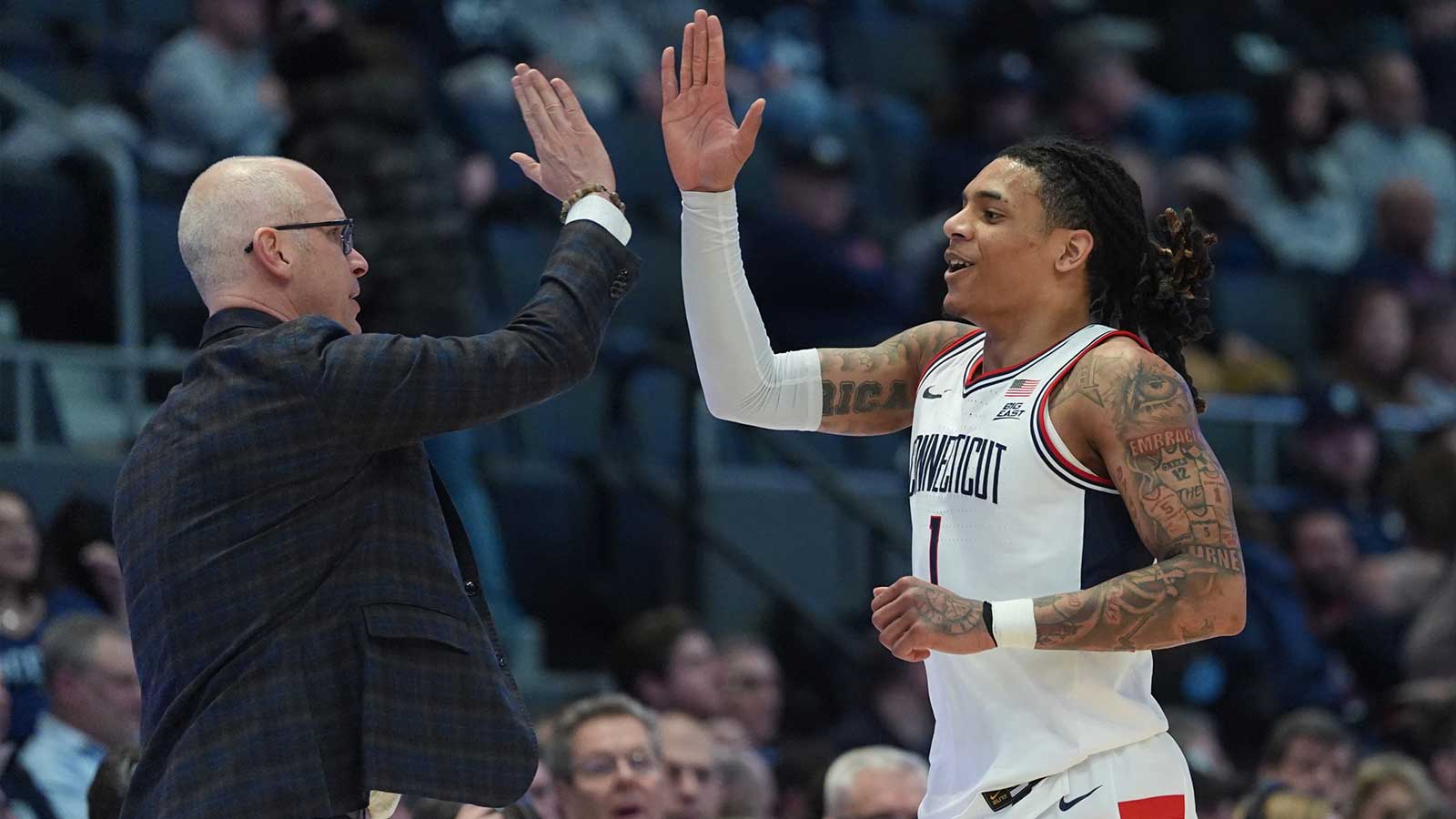 UConn Huskies head coach Dan Hurley reacts with guard Solo Ball (1) from the sideline as they take on the Xavier Musketeers at PeoplesBank Arena. 