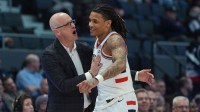 UConn Huskies head coach Dan Hurley reacts with guard Solo Ball (1) from the sideline as they take on the Xavier Musketeers at PeoplesBank Arena.