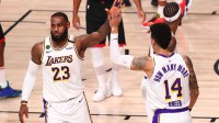 Los Angeles Lakers forward LeBron James (23) celebrates with guard Danny Green (14) in the second half of game five of the second round against the Houston Rockets in the 2020 NBA Playoffs at ESPN Wide World of Sports Complex.
