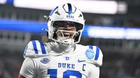 Duke Blue Devils quarterback Darian Mensah (10) celebrates after the Blue Devils score a touchdown in overtime during the ACC Championship game at Bank of America Stadium. Mandatory Credit: Bob Donnan-Imagn Images