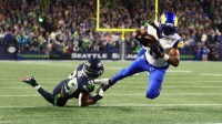 Los Angeles Rams wide receiver Davante Adams (17) makes a catch against Seattle Seahawks cornerback Josh Jobe (29) during the second half in the 2026 NFC Championship Game at Lumen Field.