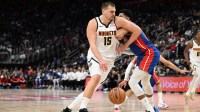 Denver Nuggets center Nikola Jokic (15) tries to drive past Detroit Pistons forward Tobias Harris (12) in the fourth quarter at Little Caesars Arena. Mandatory Credit: Lon Horwedel-Imagn Images