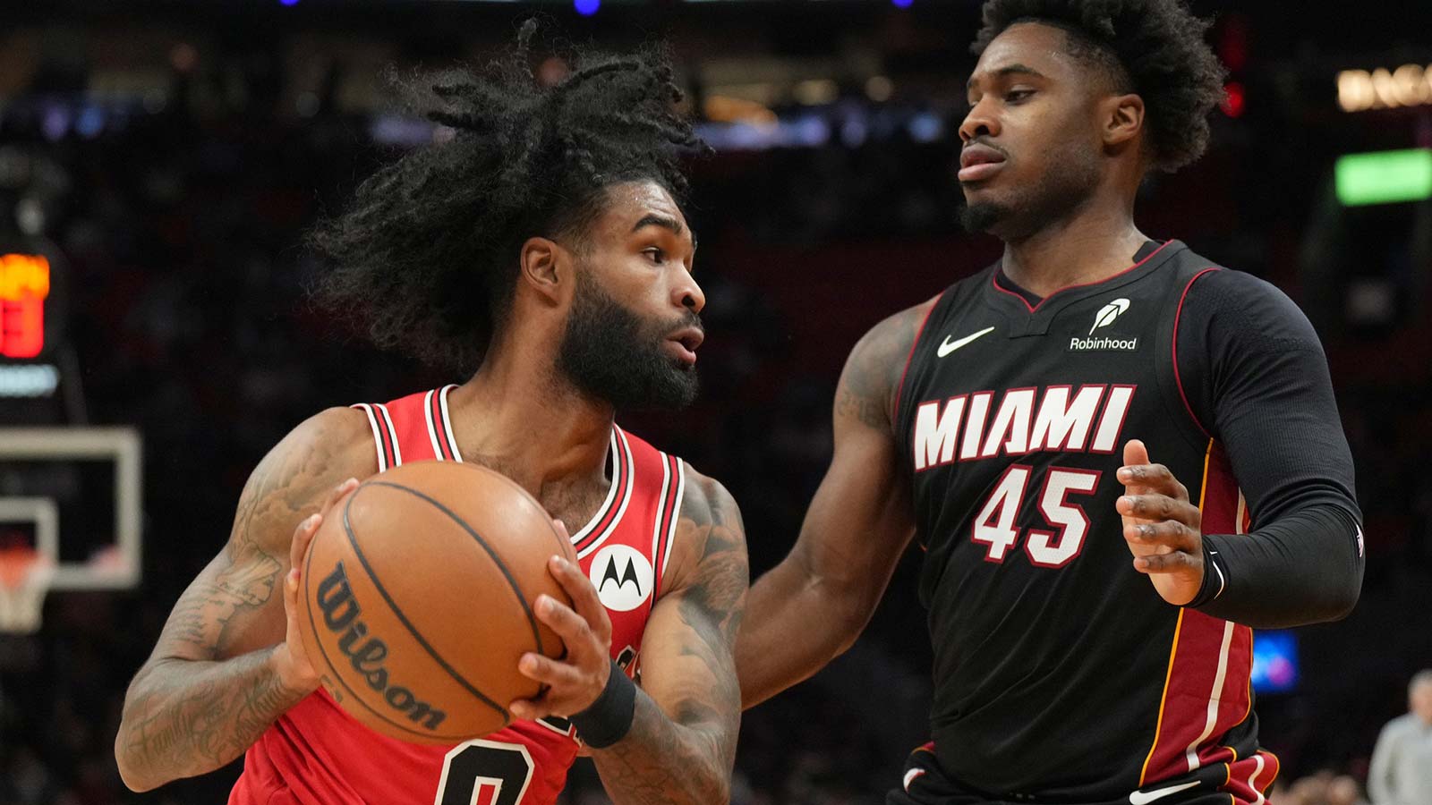 Chicago Bulls guard Coby White (0) looks to pass as Miami Heat guard Davion Mitchell (45) defends during the first half at Kaseya Center.