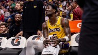 Los Angeles Lakers center Deandre Ayton (5) sits on the bench with an ice pack on his knee against the New Orleans Pelicans during the second half at Smoothie King Center.