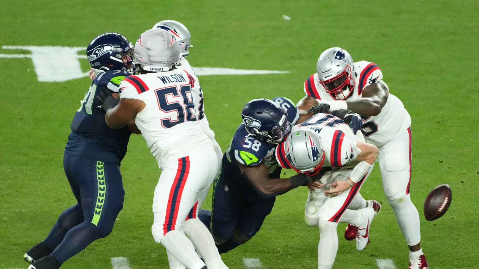New England Patriots quarterback Drake Maye (10) fumbles as he is sacked by Seattle Seahawks linebacker Derick Hall (58) in the second half in Super Bowl LX at Levi's Stadium. Mandatory Credit: Kirby Lee-Imagn Images