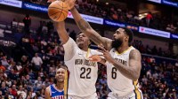 New Orleans Pelicans center Derik Queen (22) and center DeAndre Jordan (6) go for a loose ball against Philadelphia 76ers forward Jabari Walker (33) during the first half at Smoothie King Center. Mandatory Credit: Stephen Lew-Imagn Images