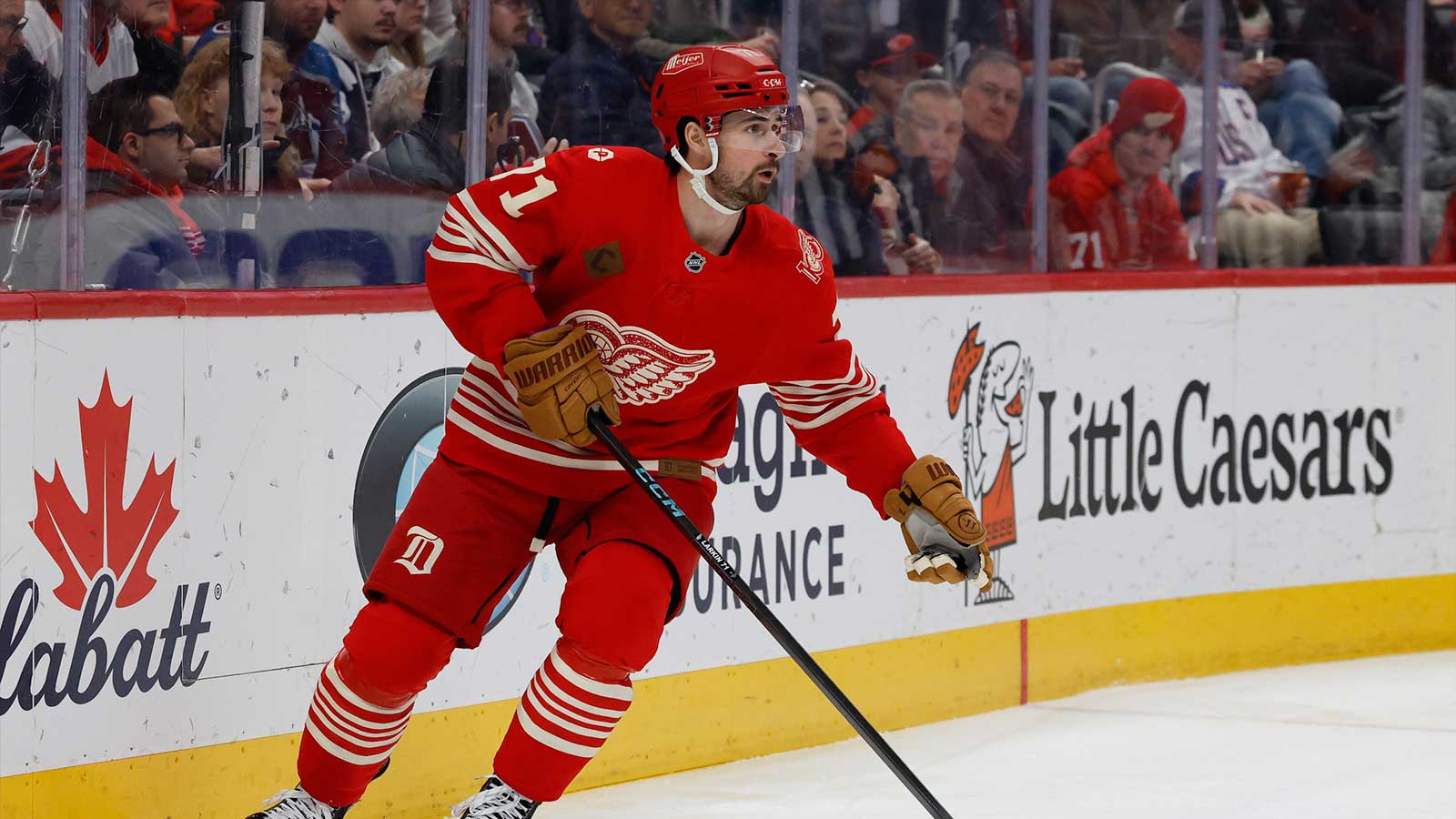 Detroit Red Wings center Dylan Larkin (71) skates with the puck in the first period against the Colorado Avalanche at Little Caesars Arena.