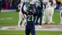 Seattle Seahawks cornerback Devon Witherspoon (21) celebrates after a play during the fourth quarter against the New England Patriots in Super Bowl LX at Levi's Stadium.
