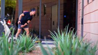 Arizona Diamondbacks outfielder Corbin Carrol (7) warms up throwing a ball against the clubhouse exterior walls during workouts at Salt River Fields at Talking Stick.