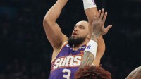 Phoenix Suns forward Dillon Brooks (3) shoots over Philadelphia 76ers guard Kelly Oubre Jr. (9) during the first half of an NBA game at Mortgage Matchup Center. Mandatory Credit: Rick Scuteri-Imagn Images