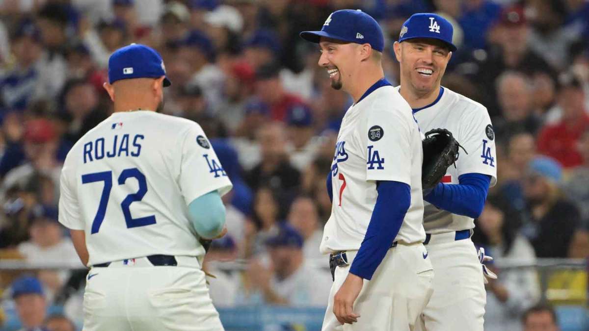 Dodgers' Blake Snell (7) celebrates with second baseman Miguel Rojas