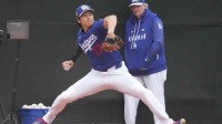 Los Angeles Dodgers pitcher Shohei Ohtani (17) throws in the bullpen during spring training camp.