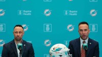 Miami Dolphins head coach Jeff Hafley, right, joined by general manager Jon-Eric Sullivan, left, speak to reporters during their introductory press conference at Baptist Health Training Complex. Mandatory Credit: Sam Navarro-Imagn Images