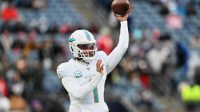 Miami Dolphins quarterback Tua Tagovailoa (1) throws a pass before the game against the New England Patriots at Gillette Stadium.