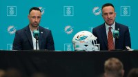Miami Dolphins head coach Jeff Hafley, right, joined by general manager Jon-Eric Sullivan, left, speak to reporters during their introductory press conference at Baptist Health Training Complex.