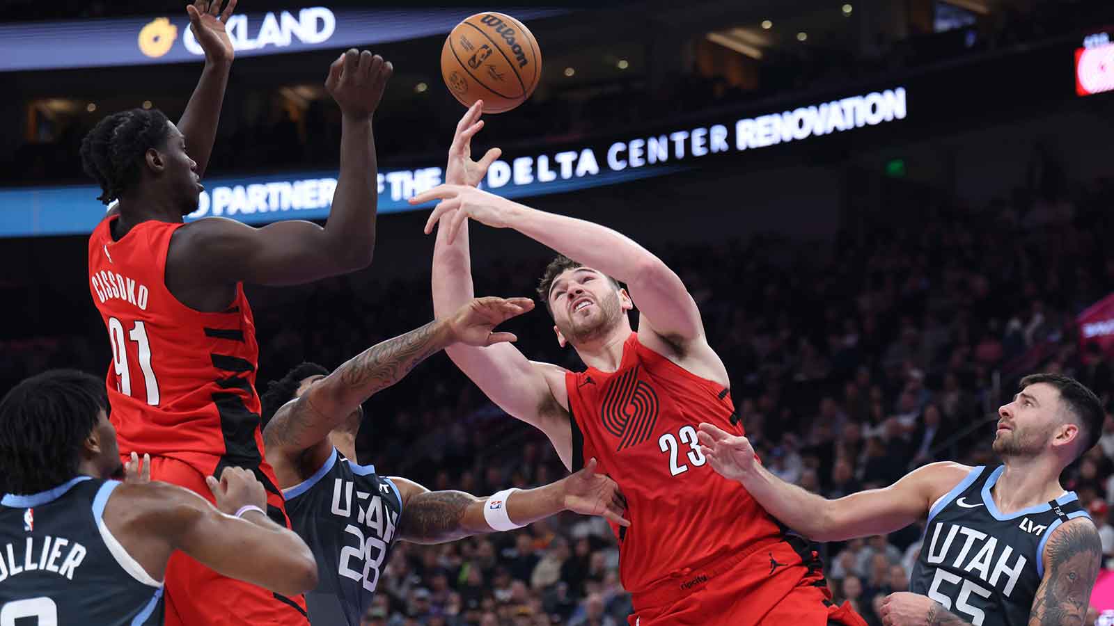 Portland Trail Blazers center Donovan Clingan (23) reaches for a loose ball during the first half against the Utah Jazz at Delta Center.
