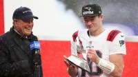 New England Patriots quarterback Drake Maye (10) holds the AFC Championship trophy while speaking to the media after defeating the Denver Broncos in the 2026 AFC Championship Game at Empower Field at Mile High.