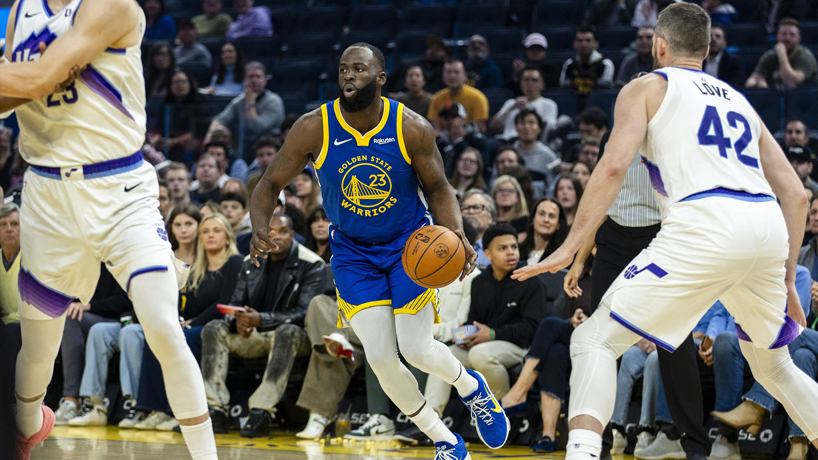 Golden State Warriors forward Draymond Green (23) dribbles against the Utah Jazz during the first quarter at Chase Center.