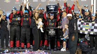 Driver Tyler Reddick (45) celebrates with his family and crew after the win at the 68th running of the Daytona 500 at Daytona International Speedway.