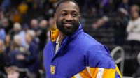 Former Marquette player Dwyane Wade looks on prior to the game against the Butler Bulldogs at Fiserv Forum.
