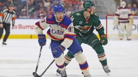 Edmonton Oilers forward Connor McDavid (97) looks to make a pass in front of Minnesota Wild forward Joel Ericksson EK (14) during the third period at Rogers Place.