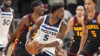 Minnesota Timberwolves guard Anthony Edwards (5) looks to pass in front of Atlanta Hawks guard Dyson Daniels (5) during the first half at State Farm Arena.