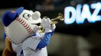 Mr. Met plays the trumpet as New York Mets relief pitcher Edwin Diaz (not pictured) enters the game against the Milwaukee Brewers during the ninth inning at Citi Field.