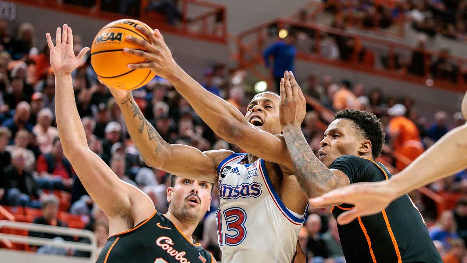 Kansas Jayhawks guard Elmarko Jackson (13) drives to the basket during the second half against the Oklahoma State Cowboys at Gallagher-Iba Arena.